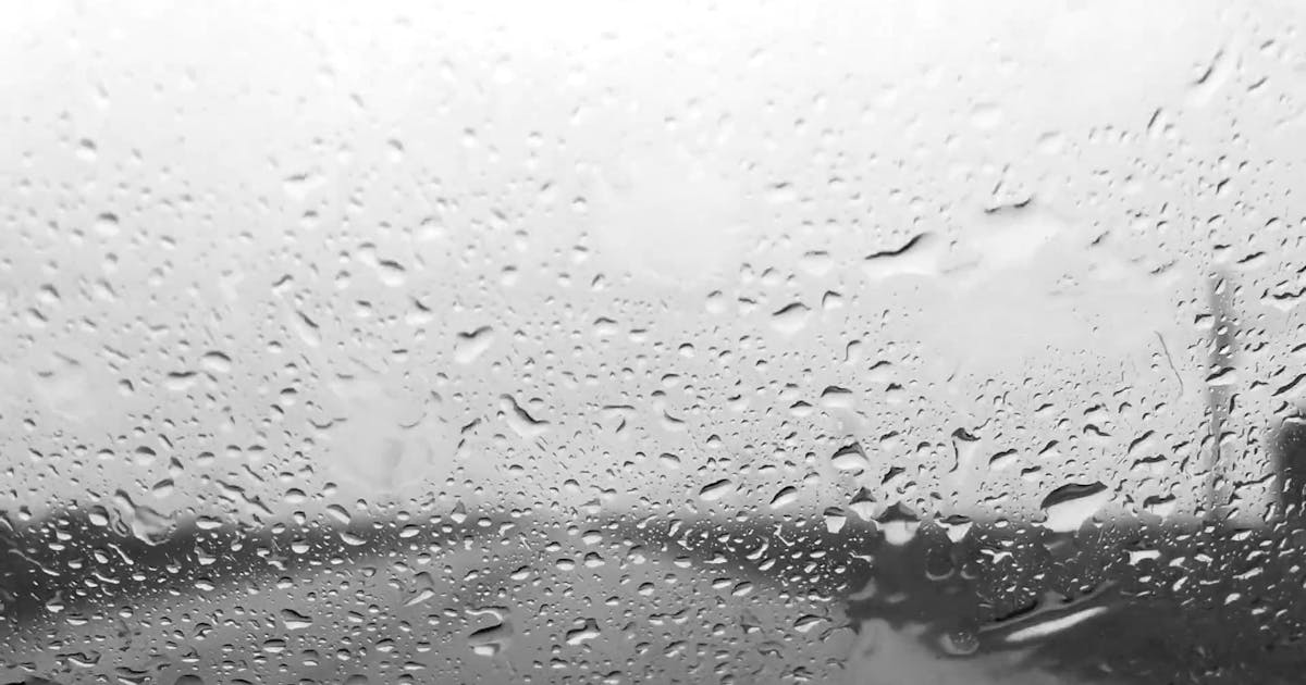 Auto glass windshield with rain droplets artistic view